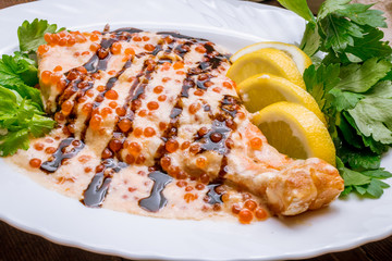 salmon in a creamy caviar sauce