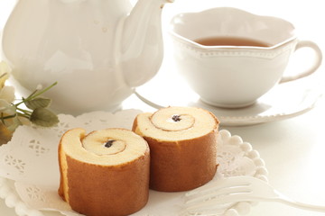 swiss roll and tea for afternoon tea image