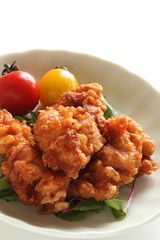 Homemade fried chicken served with cherry tomato