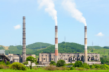 Fototapeta na wymiar Smoke pipes of a thermal power station