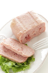 Canned food, luncheon meat on wooden plate