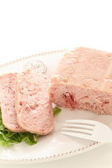 Canned food, luncheon meat on wooden plate