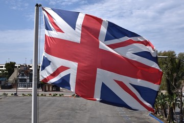 Fototapeta na wymiar British flag at the top of the flagpole seen at eye level