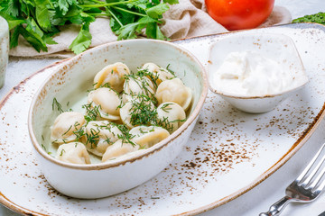 Dumplings with sour cream and herbs