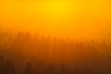 Smoke from the summer 2018 California wildfires glows under the setting sun