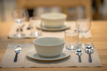 Background, table setting (spoon, glass, plate) placed on the knob to be beautiful and convenient to use.