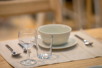 Background, table setting (spoon, glass, plate) placed on the knob to be beautiful and convenient to use.
