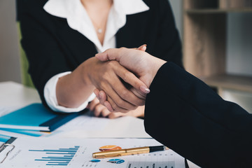 Business people shaking hands, finishing up meeting - business etiquette, congratulation, merger and acquisition concept