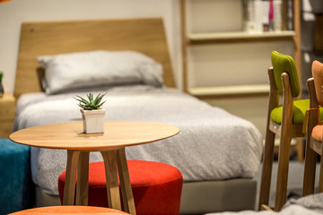 Small table with chairs in the bedroom, made of wood and the actual size.