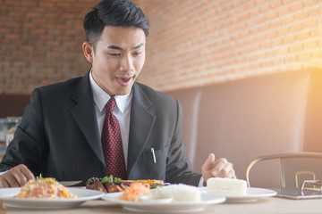 Businessmen were eating steak in a restaurant.