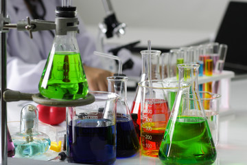 scientist working in the chemistry laboratory / researcher working in the lab analyzing.