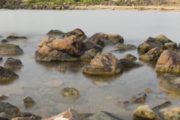The beach with stones. Big stones on the beach. Morning inflow of water. Bulgaria, Burgas, Nessebar, Olympic Hope beach