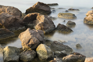 The beach with stones. Big stones on the beach. Morning inflow of water. Bulgaria, Burgas, Nessebar, Olympic Hope beach