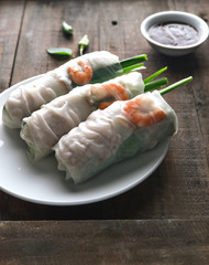 Fresh assorted Asian spring rolls set with shrimps, vegetables, fruits, copy space