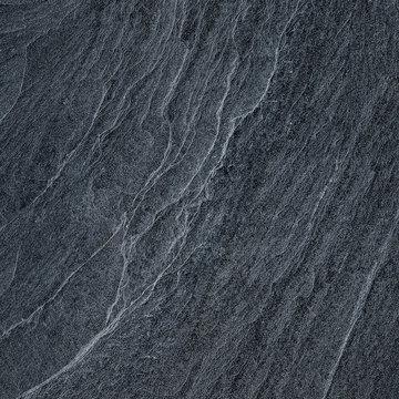 Dark grey black slate stone background or texture.