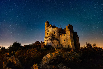 Medieval castle over the night sky