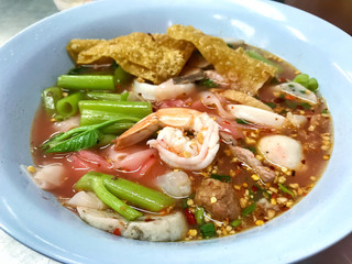 Thai noodle call yentafo with spicy soup and seafood