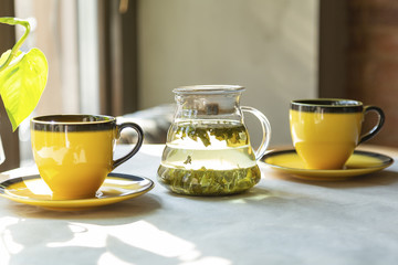 Tea in the morning, two cups of green tea on the table in the cafe.