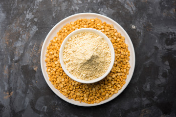 Besan, Gram or chickpea flour or powder is a pulse flour made from a variety of ground chickpea known as Bengal gram. popular ingredient for Pakora/pakoda or bajji snack. Selective focus