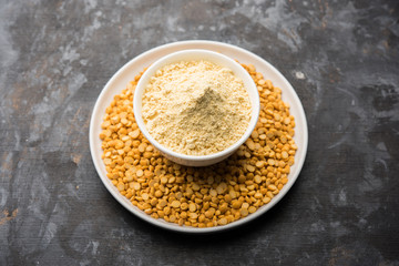Besan, Gram or chickpea flour or powder is a pulse flour made from a variety of ground chickpea known as Bengal gram. popular ingredient for Pakora/pakoda or bajji snack. Selective focus