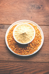 Besan, Gram or chickpea flour or powder is a pulse flour made from a variety of ground chickpea known as Bengal gram. popular ingredient for Pakora/pakoda or bajji snack. Selective focus
