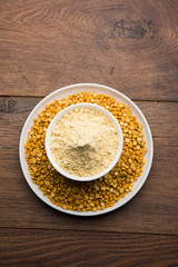 Besan, Gram or chickpea flour or powder is a pulse flour made from a variety of ground chickpea known as Bengal gram. popular ingredient for Pakora/pakoda or bajji snack. Selective focus