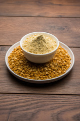 Besan, Gram or chickpea flour or powder is a pulse flour made from a variety of ground chickpea known as Bengal gram. popular ingredient for Pakora/pakoda or bajji snack. Selective focus