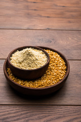 Besan, Gram or chickpea flour or powder is a pulse flour made from a variety of ground chickpea known as Bengal gram. popular ingredient for Pakora/pakoda or bajji snack. Selective focus