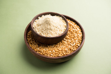 Besan, Gram or chickpea flour or powder is a pulse flour made from a variety of ground chickpea known as Bengal gram. popular ingredient for Pakora/pakoda or bajji snack. Selective focus