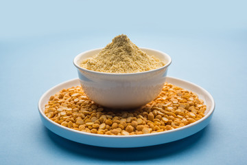 Besan, Gram or chickpea flour or powder is a pulse flour made from a variety of ground chickpea known as Bengal gram. popular ingredient for Pakora/pakoda or bajji snack. Selective focus