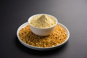 Besan, Gram or chickpea flour or powder is a pulse flour made from a variety of ground chickpea known as Bengal gram. popular ingredient for Pakora/pakoda or bajji snack. Selective focus