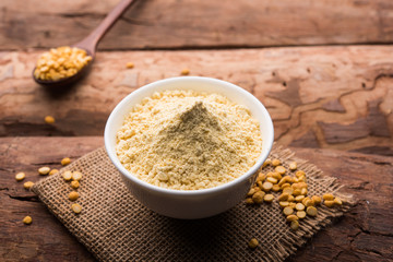 Besan, Gram or chickpea flour or powder is a pulse flour made from a variety of ground chickpea known as Bengal gram. popular ingredient for Pakora/pakoda or bajji snack. Selective focus