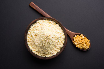 Besan, Gram or chickpea flour or powder is a pulse flour made from a variety of ground chickpea known as Bengal gram. popular ingredient for Pakora/pakoda or bajji snack. Selective focus