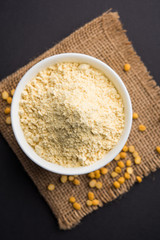 Besan, Gram or chickpea flour or powder is a pulse flour made from a variety of ground chickpea known as Bengal gram. popular ingredient for Pakora/pakoda or bajji snack. Selective focus