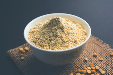 Besan, Gram or chickpea flour or powder is a pulse flour made from a variety of ground chickpea known as Bengal gram. popular ingredient for Pakora/pakoda or bajji snack. Selective focus