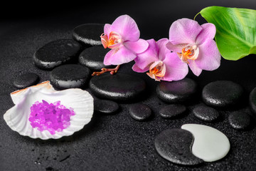 Fototapeta na wymiar spa concept of zen and Yin-Yang stones, lilac orchid