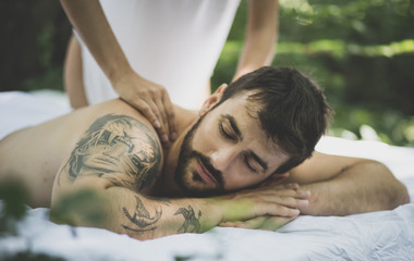 Obraz na płótnie Canvas Close up image of men at massage treatment.