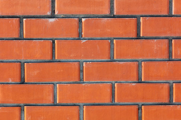 Obraz premium Ściana z czerwonej cegły jako abstrakcyjne tło