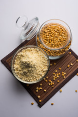 Besan, Gram or chickpea flour or powder is a pulse flour made from a variety of ground chickpea known as Bengal gram. popular ingredient for Pakora/pakoda or bajji snack. Selective focus