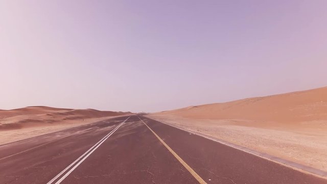 New road from Oasis Liwa to Moreeb Dune in Rub al Khali desert stock footage video