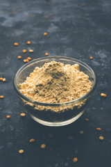 Besan, Gram or chickpea flour or powder is a pulse flour made from a variety of ground chickpea known as Bengal gram. popular ingredient for Pakora/pakoda or bajji snack. Selective focus