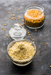 Besan, Gram or chickpea flour or powder is a pulse flour made from a variety of ground chickpea known as Bengal gram. popular ingredient for Pakora/pakoda or bajji snack. Selective focus