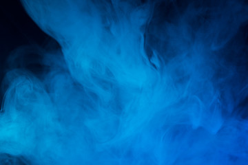Colorful smoke close-up on a black background
