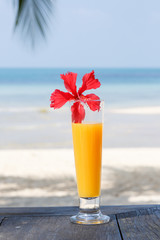 glass of juice with a view of the sea.