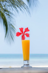 glass of juice with a view of the sea.