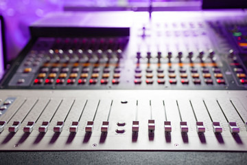 Sound mixer. Professional audio mixing console with lights, buttons, faders and sliders.