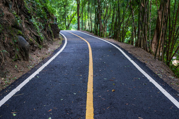 Fototapeta na wymiar Asphalt road pavement at national park Chiang mai in Thailand