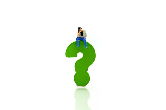 Miniature people : Businessman with THE QUESTION MARK using for concept Punctuation Day