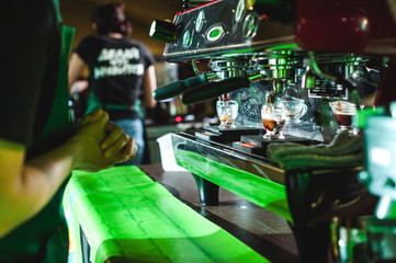 Fototapeta na wymiar championship among coffee houses, members of teams show barista's skill, prepare drinks, teamwork