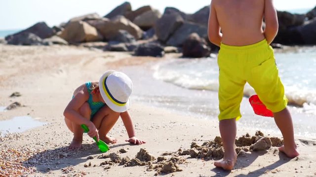children build sand sea beach